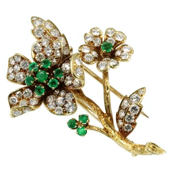 Fifties French gold flower brooch with brilliants and emeralds